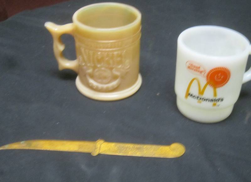 lot 132 image: LOT - Mcdonalds Mug, Universal Letter Company Letter Opener, What a Burger Nickel Coffee