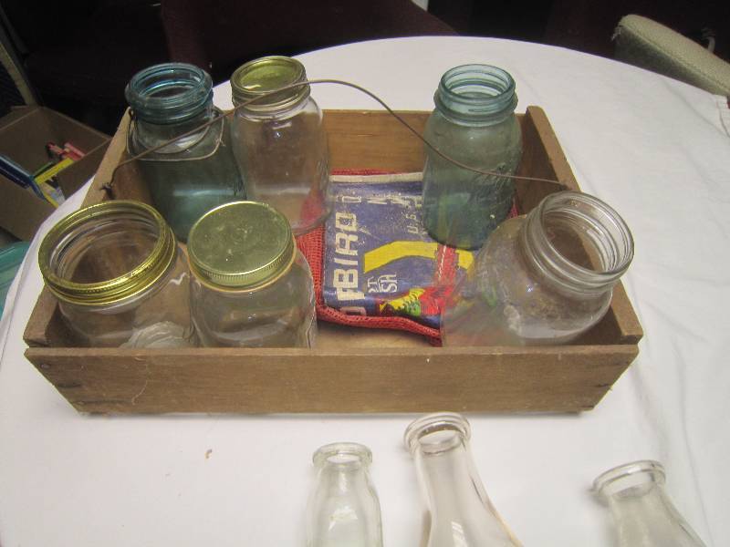 lot 158 image: LOT - Cocola Quality Fruits and Vegetables Labeled Wood Box with Handle, Old Mason Jar, 2 Cream Bottles and 1 Milk Bottle