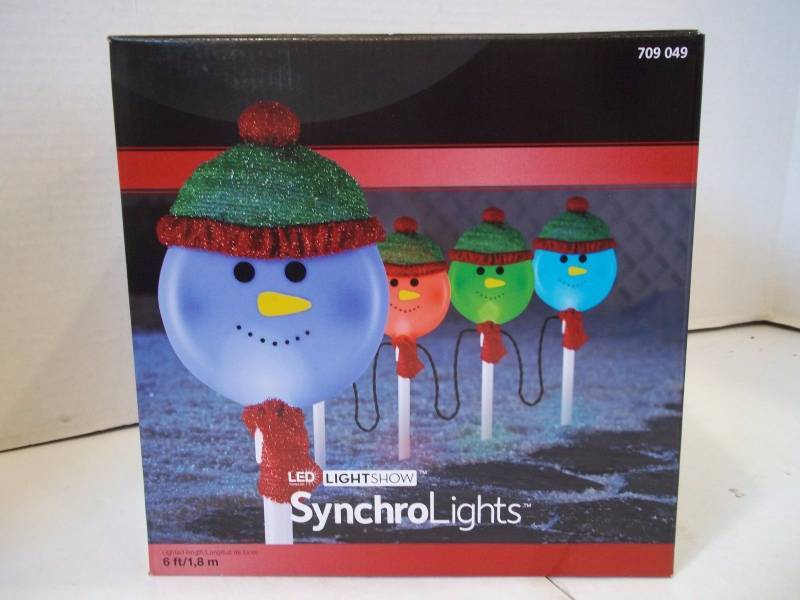 lot 45 image: Gemmy LED LightShow SynchroLights 4 Snowman Color Changing Pathway Markers
