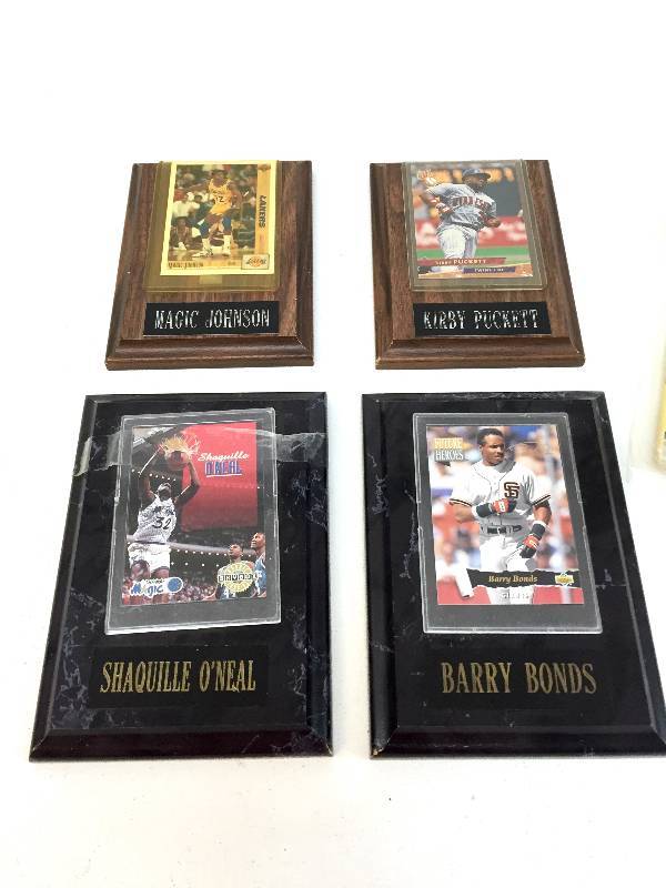 lot 26 image: 4  Framed Sports Cards & 6 Million Dollar Man Comic Book