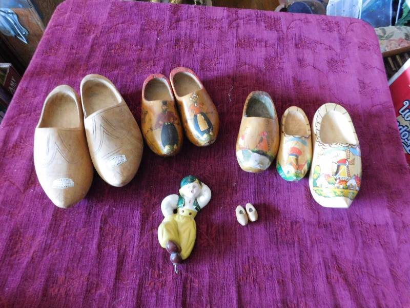 lot 26 image: two pair of matching clogs, three left foot clogs and one tiny pair