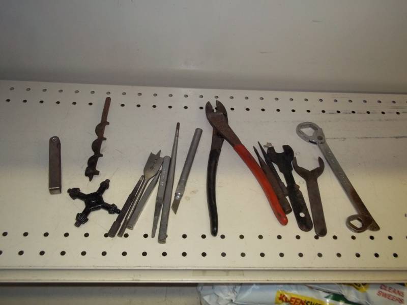 Lot of tools with drill bits and multi wrench