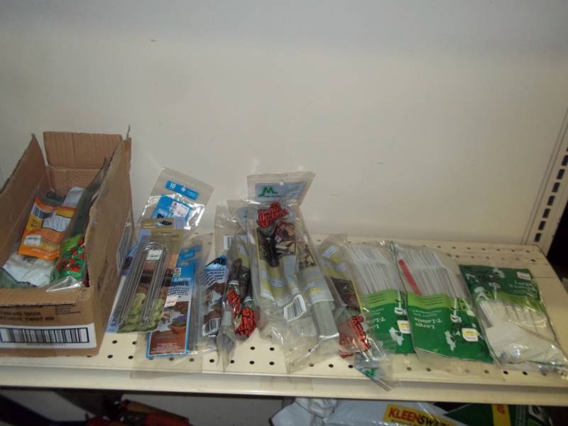Shelf lot of NEW plant markers and plant staples with ties