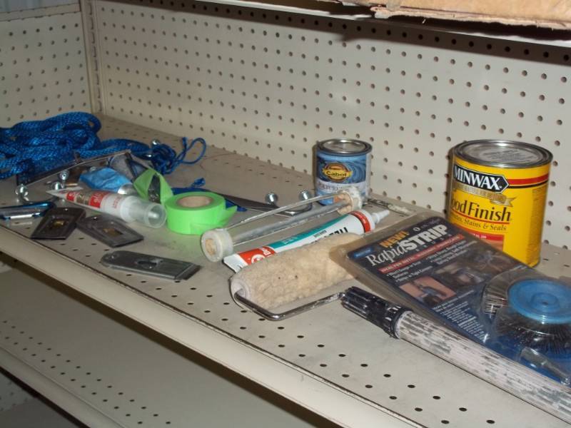 Shelf lot with drill paint stripers, wood finish, paint roller and rope