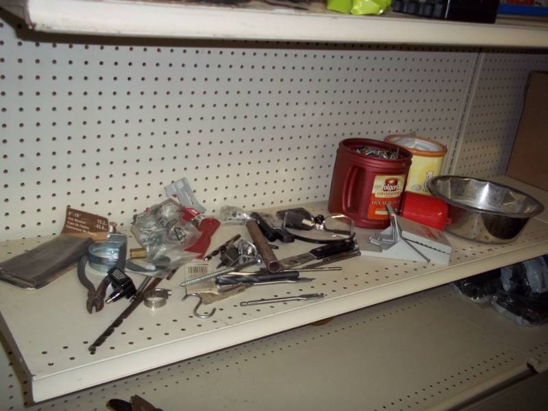 Shelf lot with dog bowl,  drill bits, and mouse trap