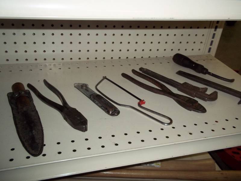 Shelf lot of vintage tools with monkey wrench