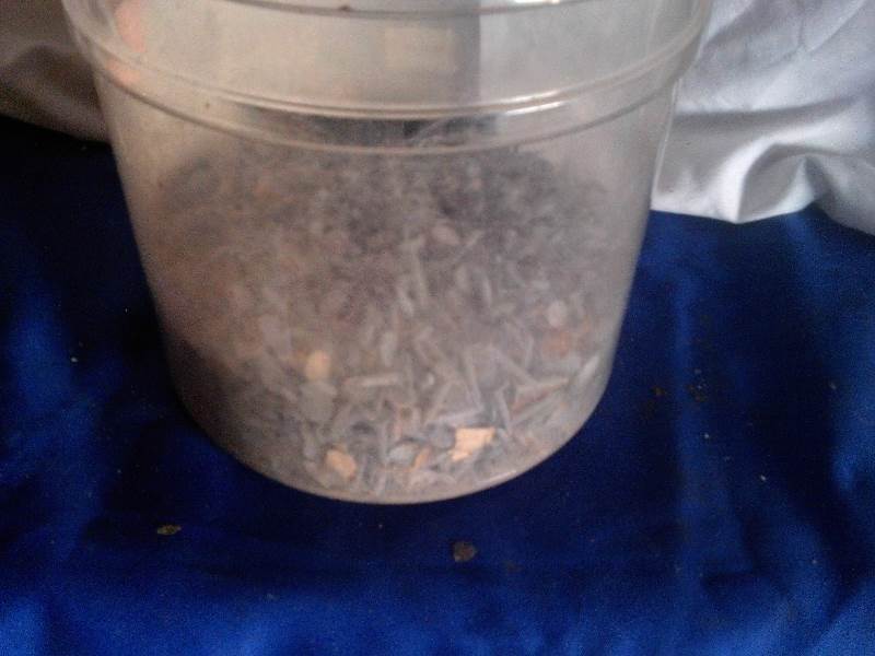 half bucket of shingle nails
