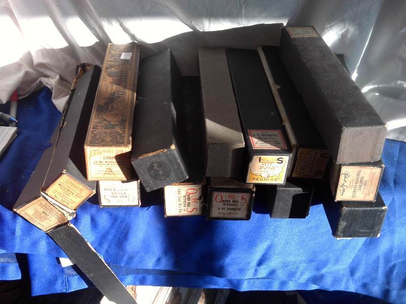 box of vintage piano scrolls