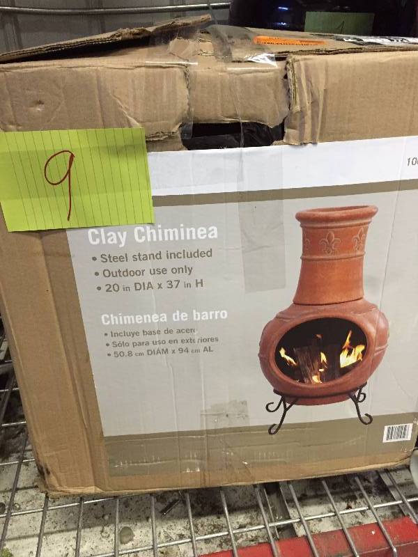 Fleur de Lis 37 in. Clay Chiminea with Iron Stand- has a line crack pls review pictures