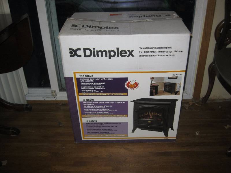 lot 11 image: New In The Box Dimplex Electric Heater Stove.