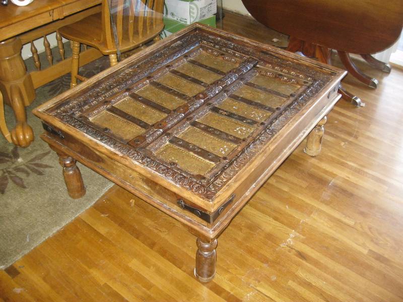 lot 21 image: This Is An Amazing Coffee Table. Not Sure Where It Is From Or What It Is. Ive Never Seen Anything Like It. The Wood Is Carved Inside And Is Accented By Copper And Brass Plates With Iron. 35x43x19