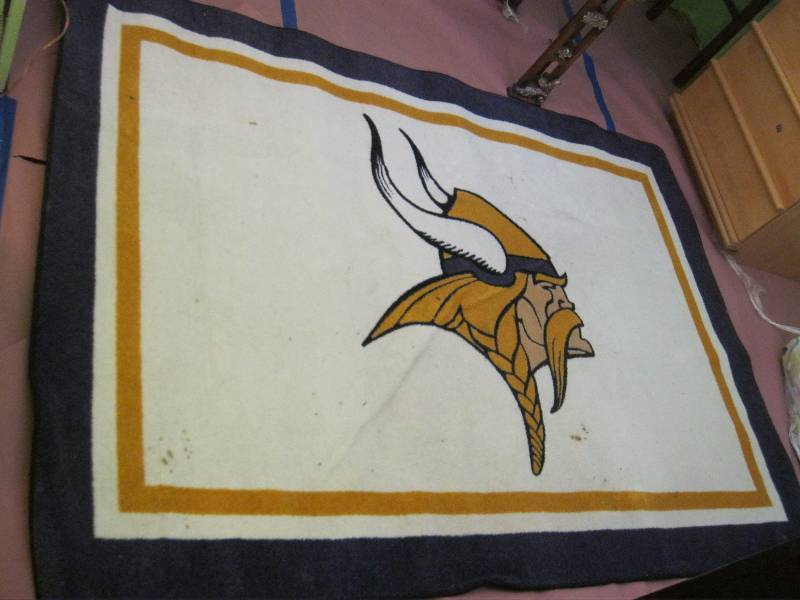 lot 37 image: Minnesota Viking Rug. Has Wear. 54x78
