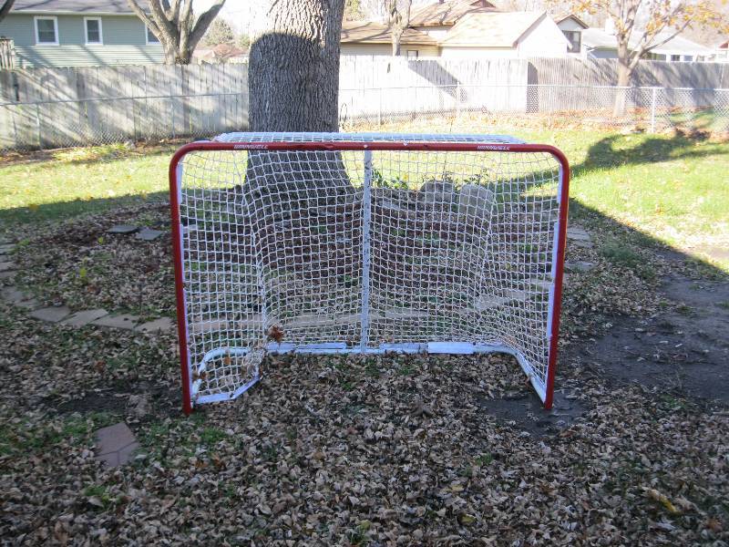 lot 53 image: Winnwell Goalie Net. Good Condition. Has Puck Marks and Dents.
