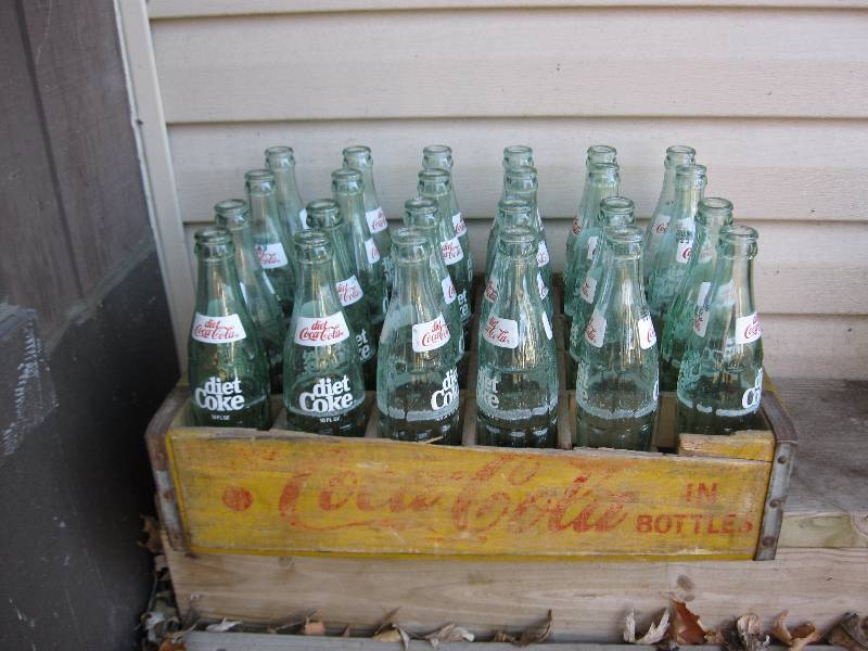 lot 54 image: Vintage Yellow Coke Wood Crate With Bottles.
