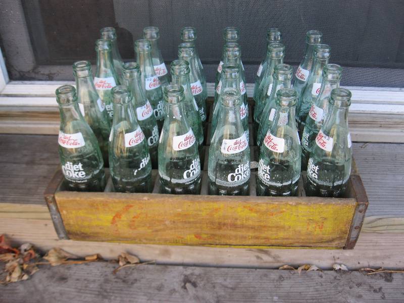lot 57 image: Vintage Yellow Coke Wood Crate With Bottles.