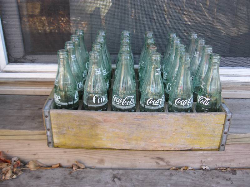 lot 58 image: Vintage Yellow Coke Wood Crate With Bottles.