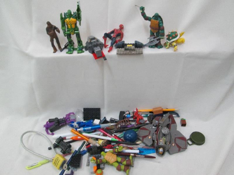 Toy figurines, lock, pens, misc in ...