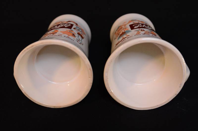 lot 23 image: Pair of Steins - Schlitz Beer