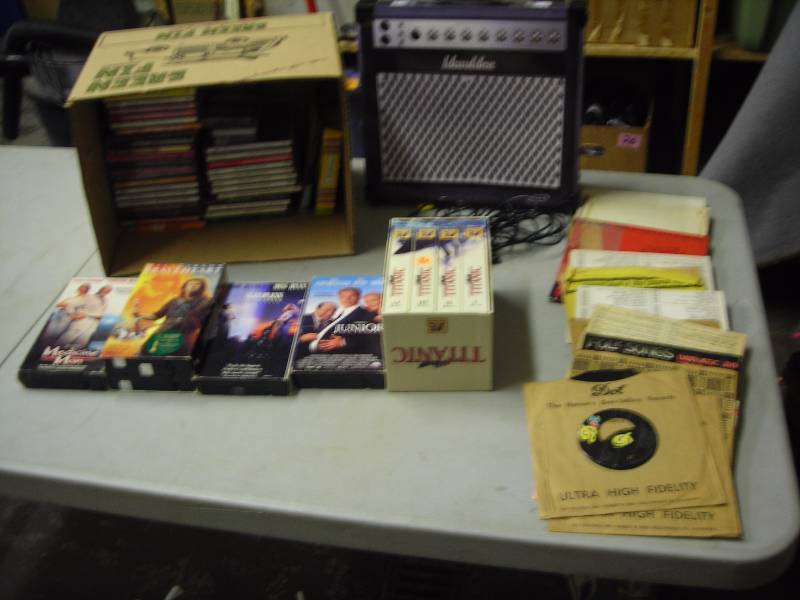 lot 26 image: Assortment Of CDs, 45s & VHS Movies