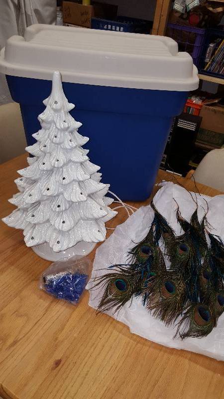 lot 50 image: Ceramic Tree With Blue Bird Lights, 4 Peacock Feathers Includes Tote