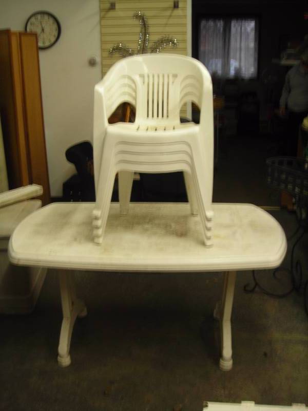 lot 39 image: Plastic Patio Table & 4 Chairs 58 x 34 Folding Legs