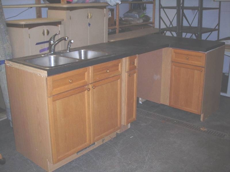 lot 40 image: L-Shaped Kitchen Cabinet Set, Counter, Stainless Sink With Faucets- 96 Inches x 45 Inches x 37 Inches
