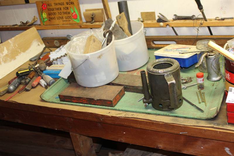 lot 12 image: Shelf Lot includes small tool boxes (2), screwdrivers, an auger, white twine, First Aid Travel Kit, and more.  Does not include vice tool.
