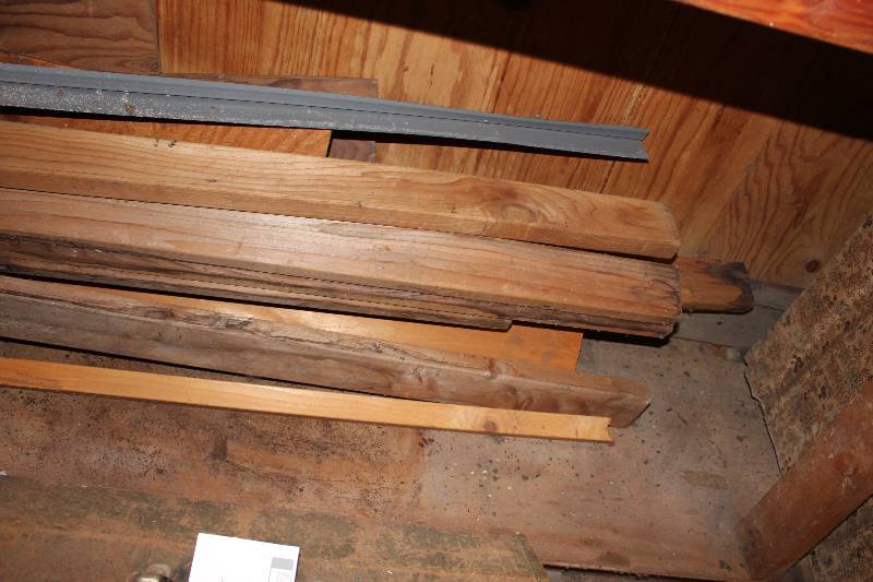 lot 14 image: Under Shelf Lot includes various lumber, a barrel filled with various metal pieces and more