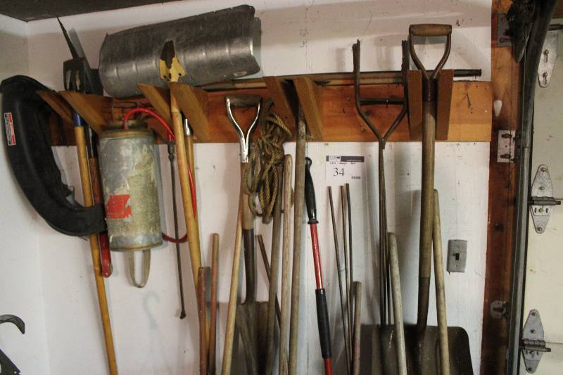lot 34 image: Wall Tools Lot includes various shovels, rakes, brooms, rope and more