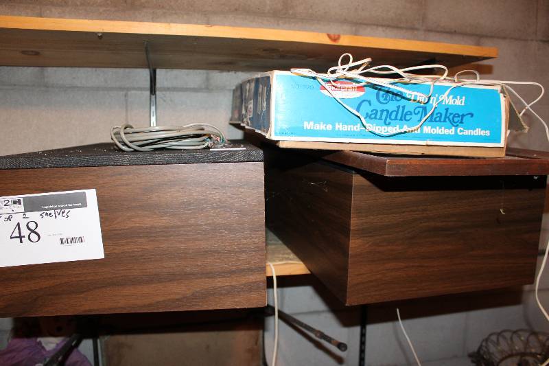 lot 48 image: Shelf Lot (top two shelves) Fisher brand speakers, pillows and more