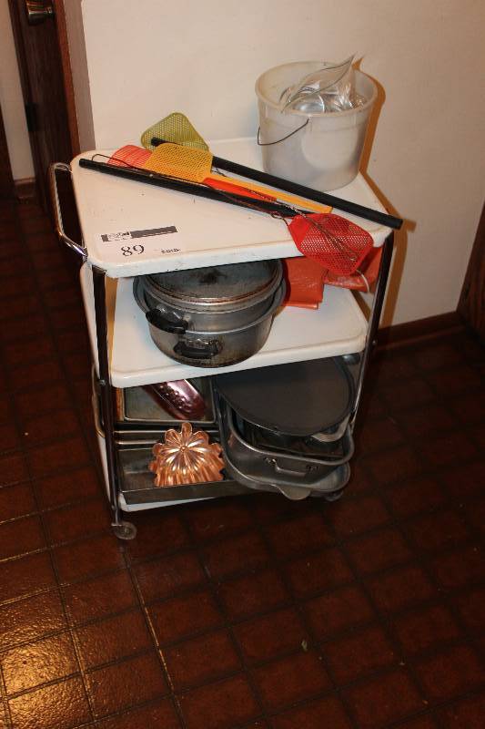 lot 89 image: Kitchen Cart with baking pans, fly swatters and more
