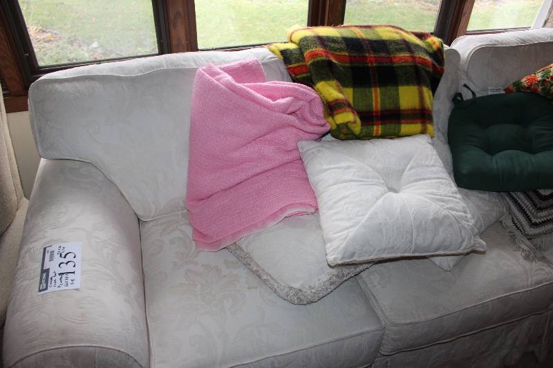 lot 135 image: White Couch and Love Seat Combination - Includes Pillows (6) and Blankets (3)