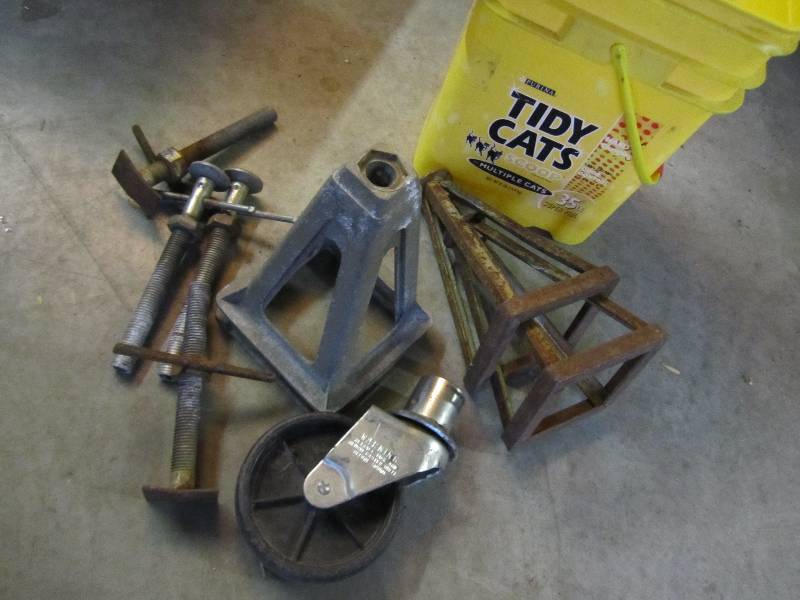 Bucket of car stands and a caster w...