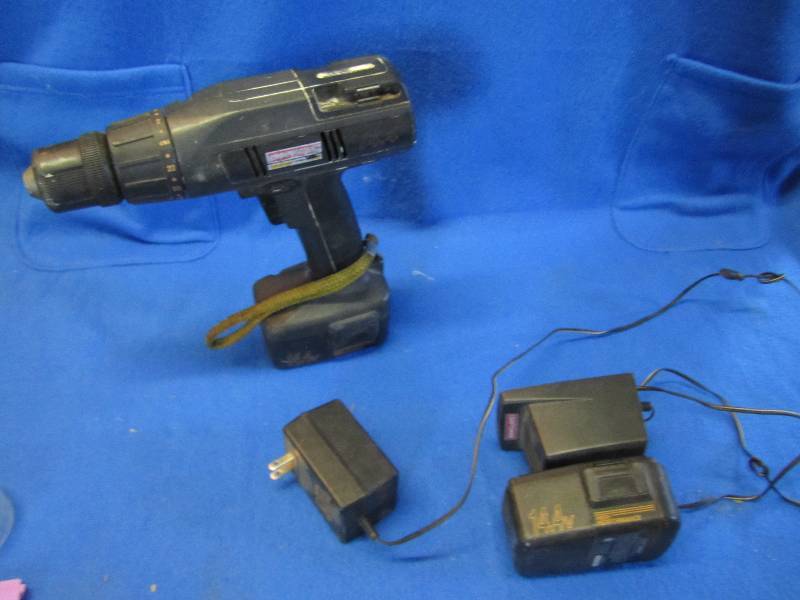 cordless drill with 2 batteries and...