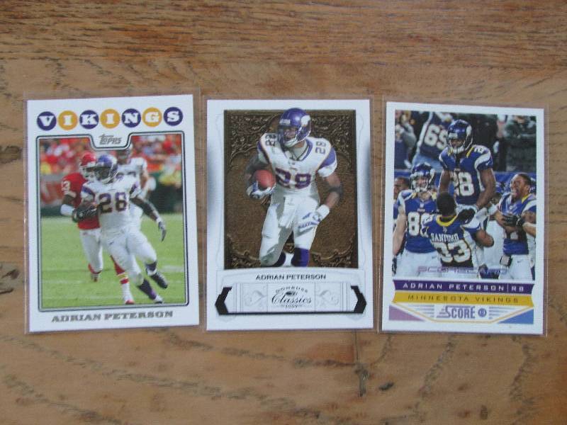 3 Adrian Peterson cards...