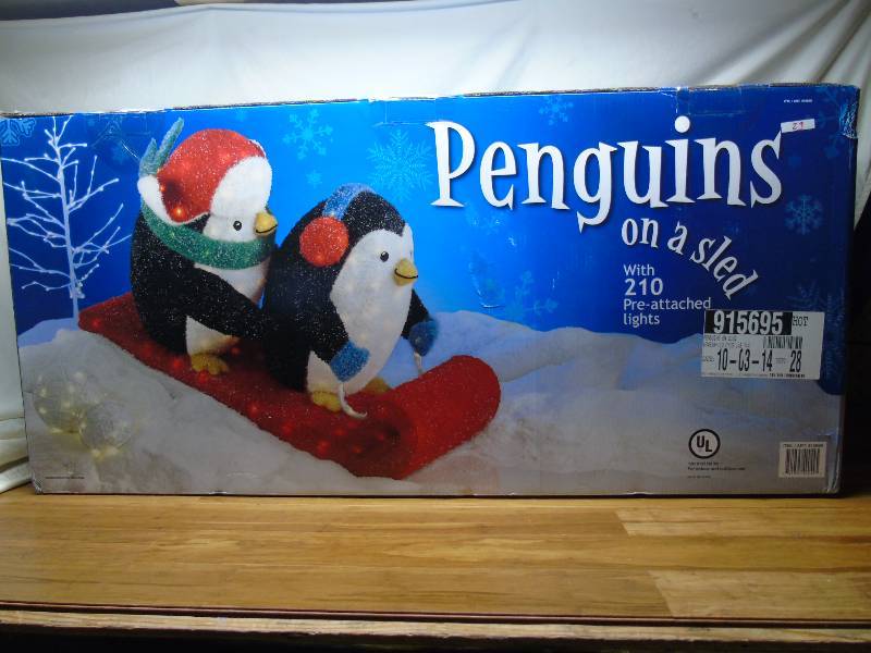 Penguins on a sled