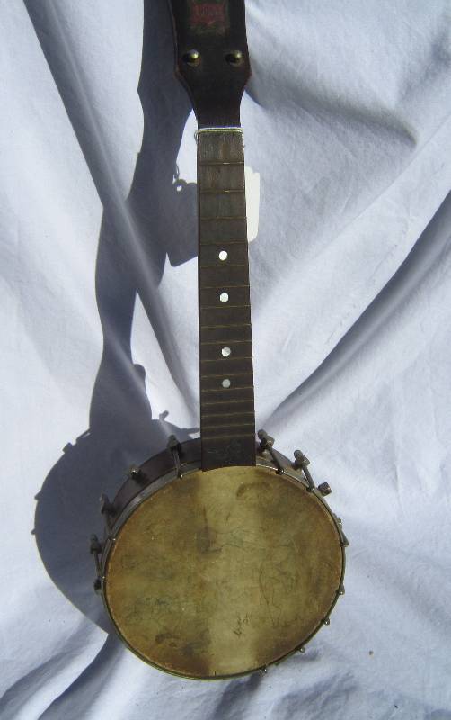 Vintage Pony Banjo with artistic work on hide.