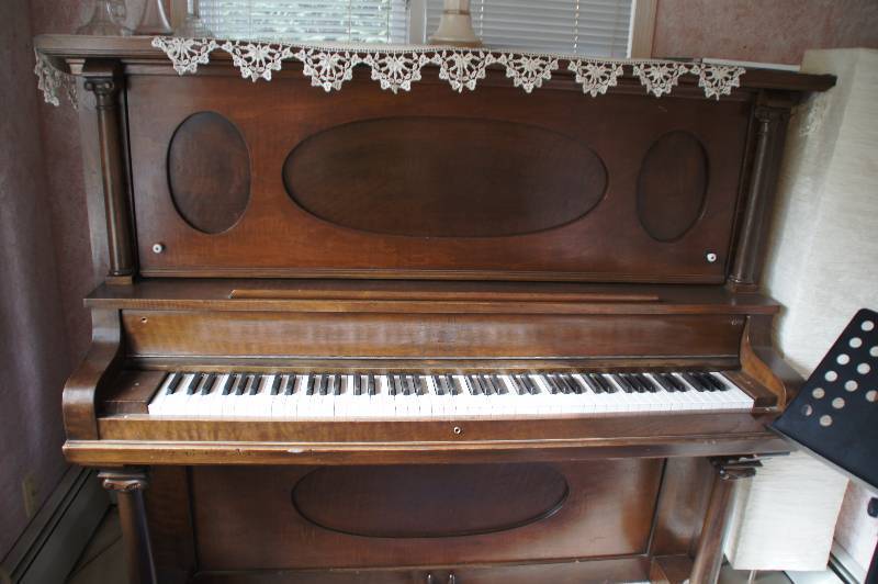 Upright Antique Piano Works great Been Refurbished