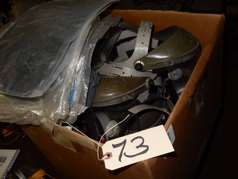 lot 73 image: Box of face sheilds and head gear