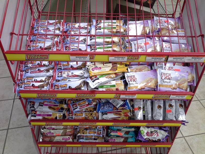 lot 28 image: Rack & Approximately 250 Various granola and cereal bars