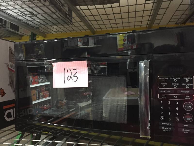 lot 123 image: Over the range Microwave New