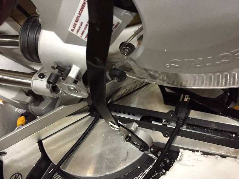 lot 162 image: Chicago Electric 12 in Miter Saw with laser- works however there is a broken piece
