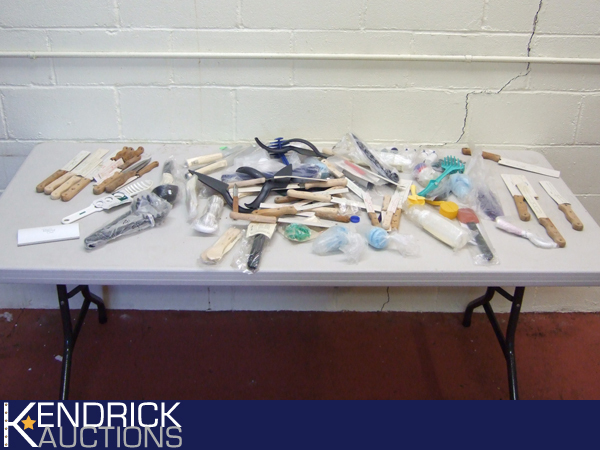 Large Lot of New Pampered Chef and Tupperware Knives etc.