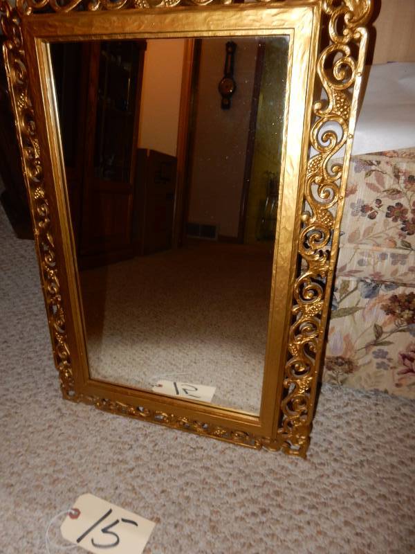 Gold painted wood framed mirror.. 17 in x 25in h.. Nice shape