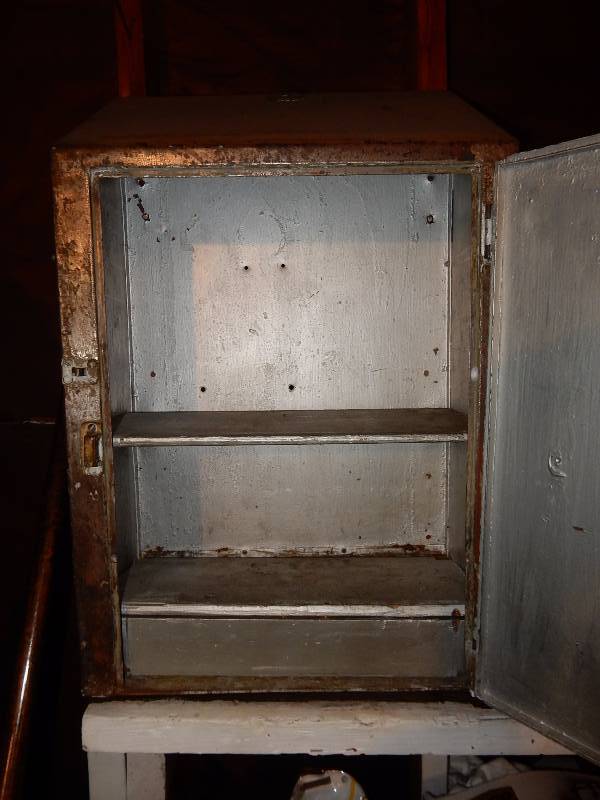 Metal wall cabinet with door.. Solid.. Has nice WORKING old latch.. You must remove this yourself.