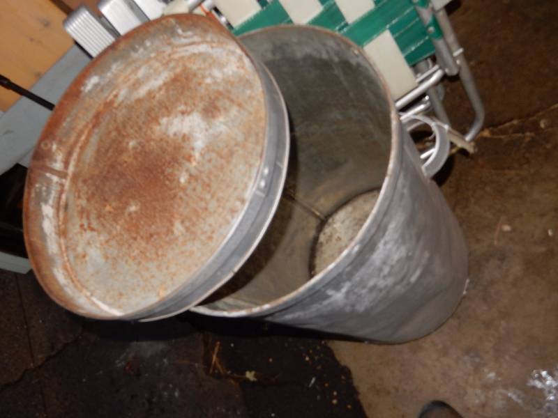 Misc. items as pictured. Includes  5 lawn chairs.. Metal barrel on wheels, 4in x 4in CEDAR post.. Other items as pictured.
