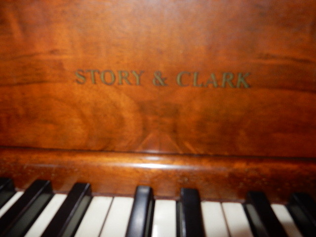 Story and Clark Spinnet type piano.. Beautiful Walnut cabinet with Nice piano bench