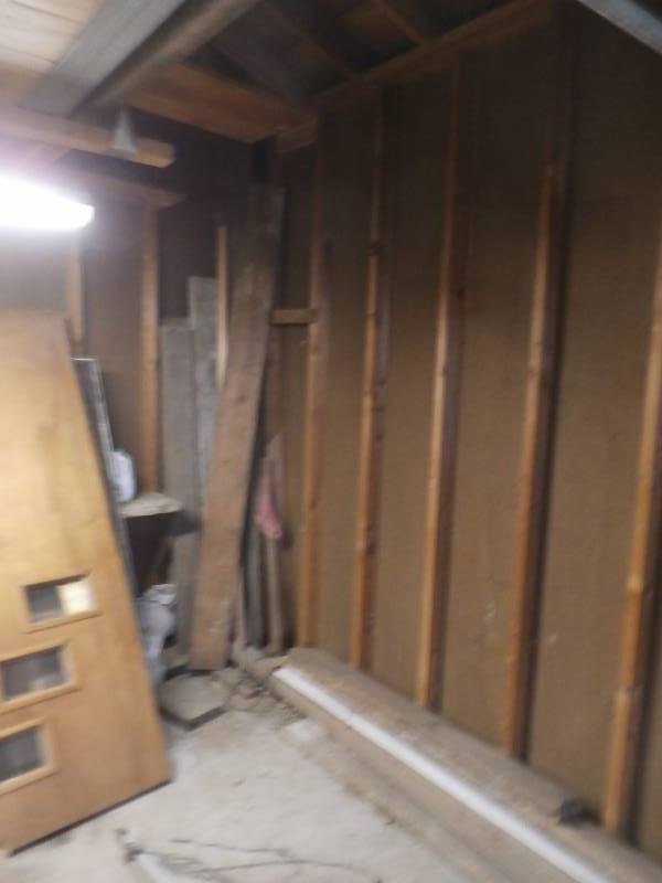 2x6 and misc lumber standing in corner.