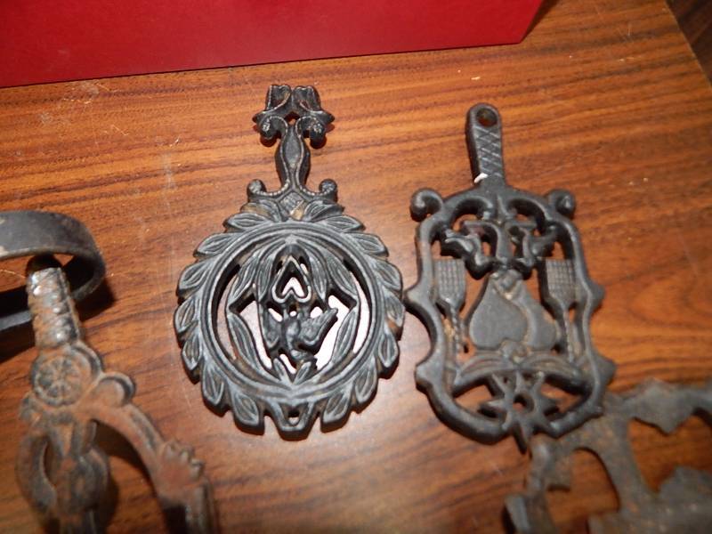 lot 117 image: Antique Light holder, Finger lamp and trivets