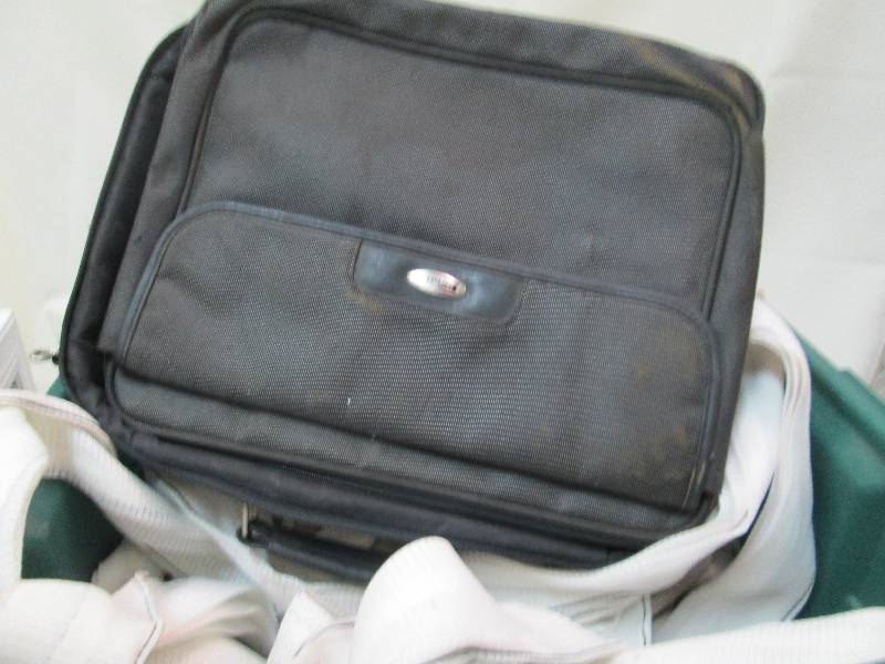Laptop bag and bin of strapping mat...